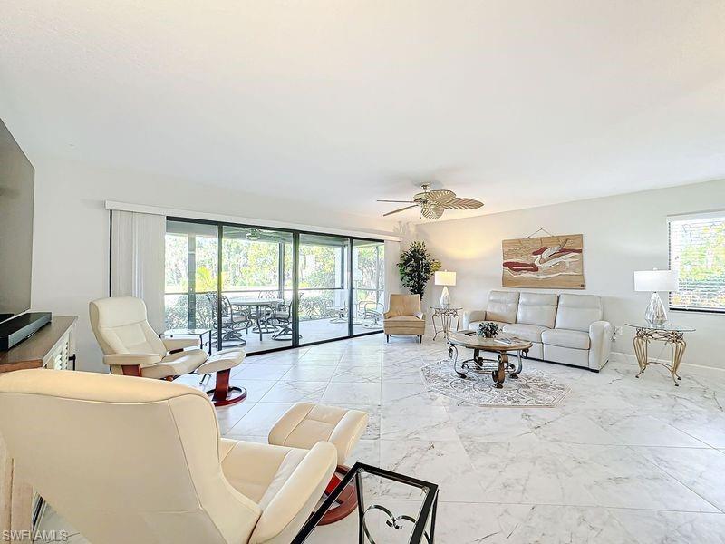 Living room featuring ceiling fan