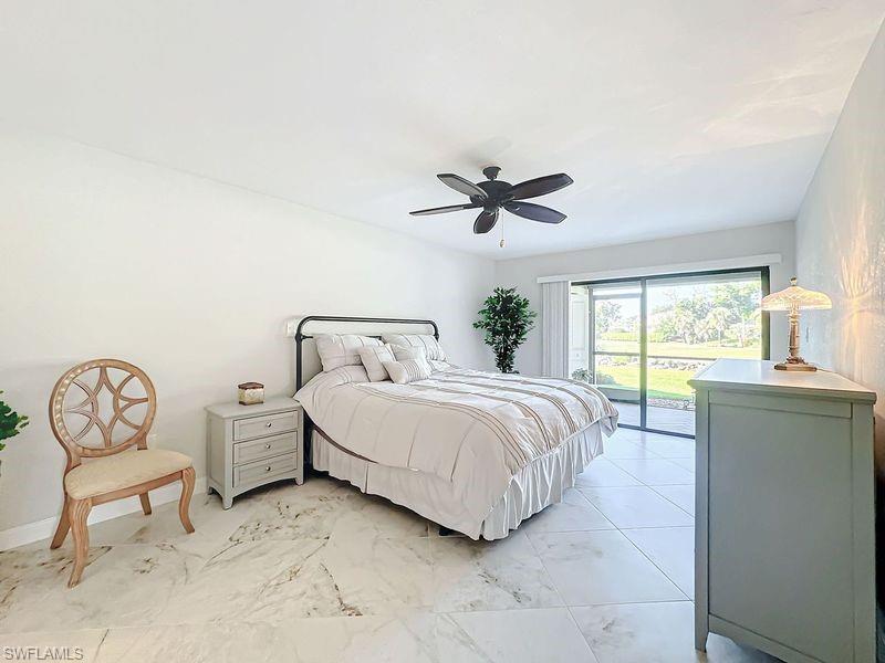 Bedroom with ceiling fan and access to exterior