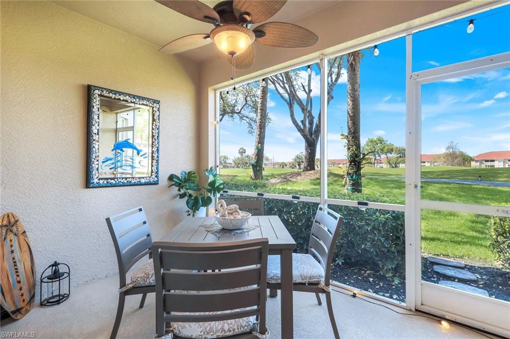 Sunroom / solarium with ceiling fan and outdoor dining space