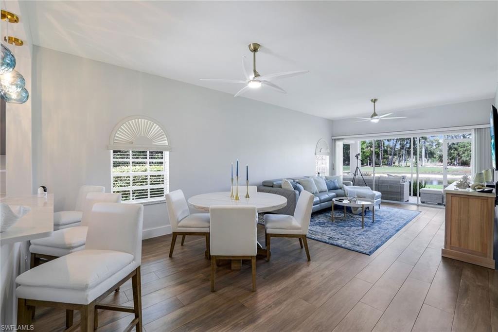 Dining space featuring wood finished floors and ceiling fan