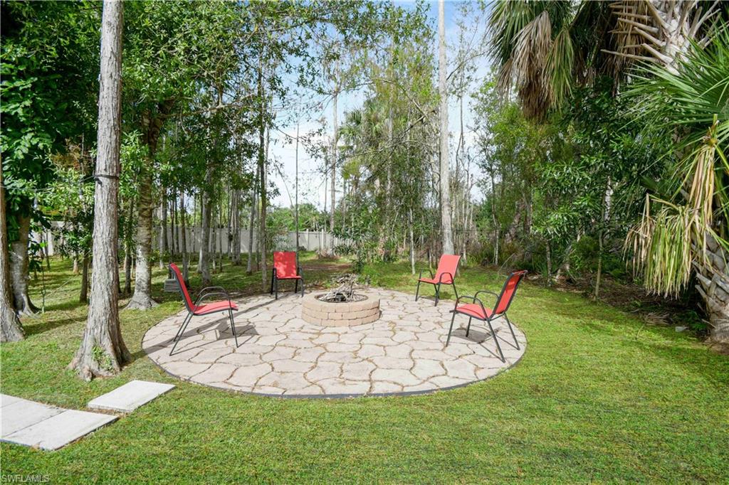 wooded yard with fire pit