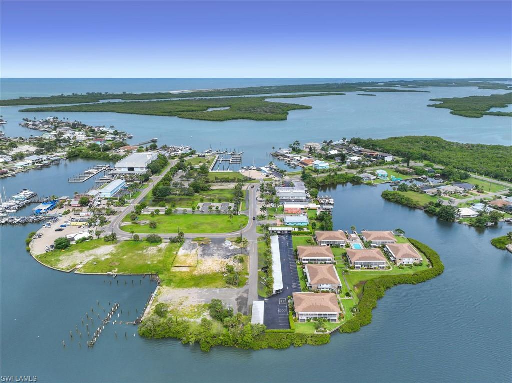 Waterfront community featuring multiple docks, direct water access, established residential buildings, and extensive green spaces