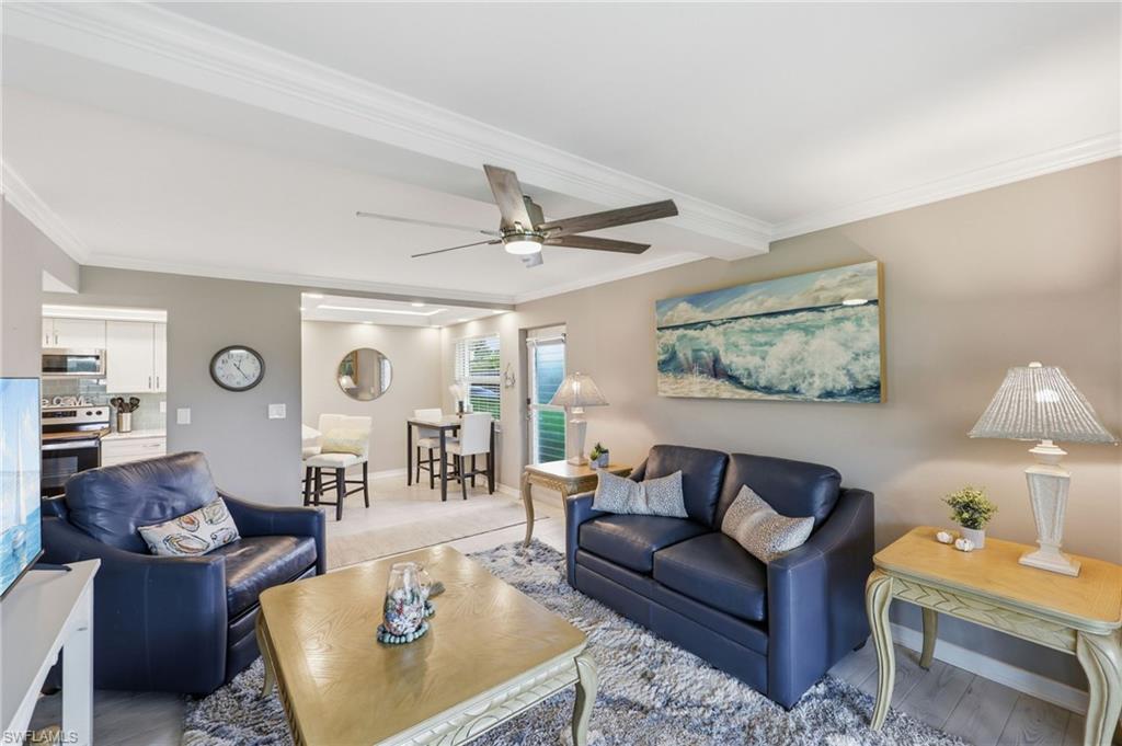 Open concept living area featuring wood-finish flooring, recessed lighting, and a ceiling fan