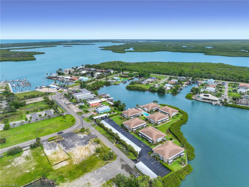 Aerial perspective featuring a waterfront community with extensive water access