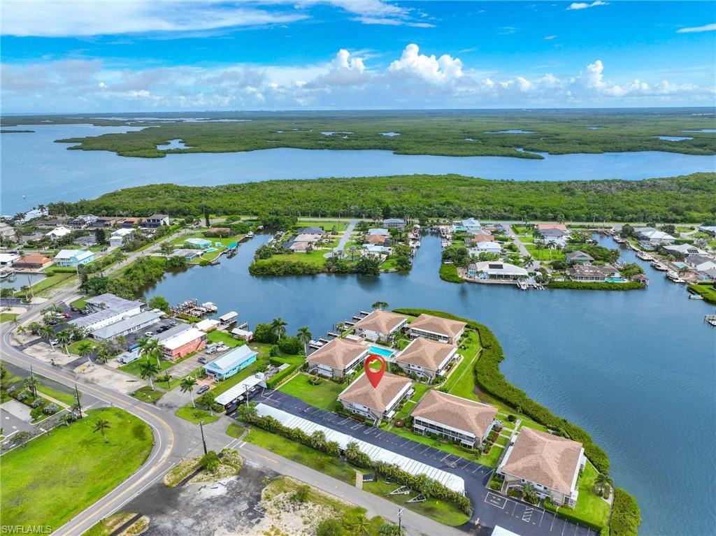 Aerial perspective showcasing waterfront community with direct canal access