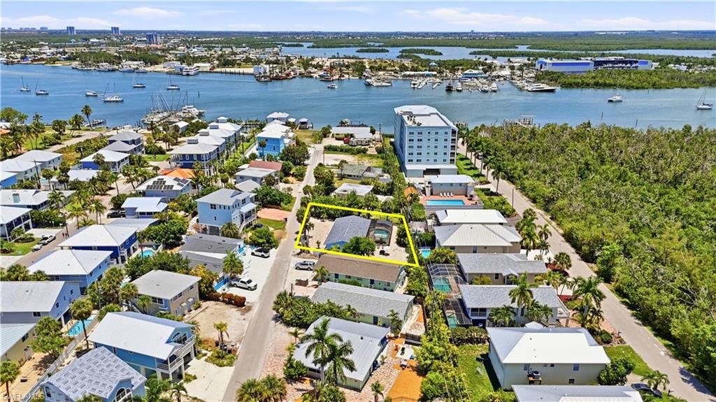 Aerial perspective showcasing the property's proximity to the waterfront - Virtually Edited Image