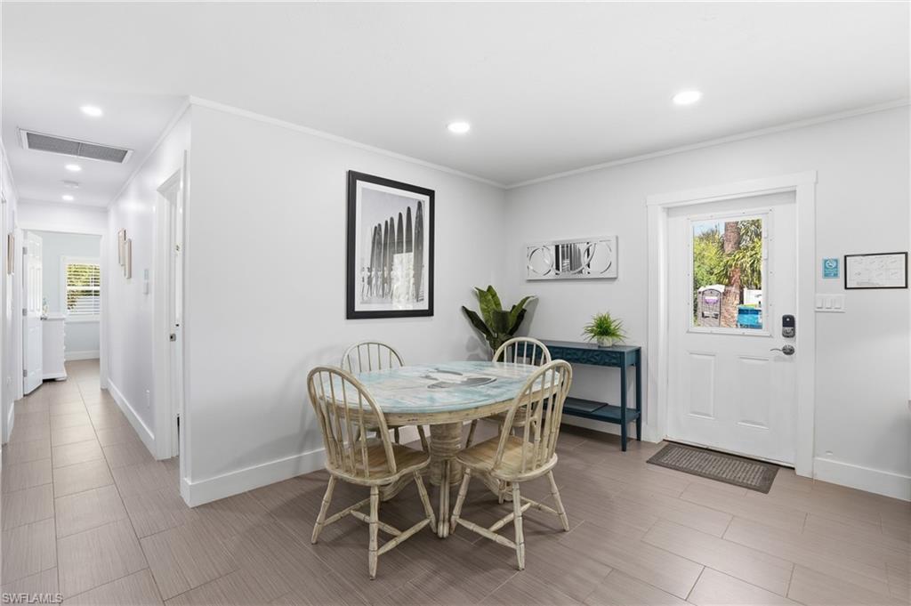 Light gray wood-finish flooring extends throughout this interior space - Virtually Edited Image
