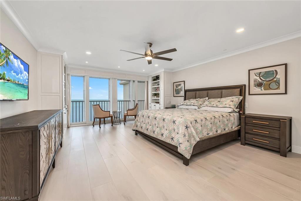 Bedroom with recessed lighting, light wood-style floors, access to exterior, and ornamental molding