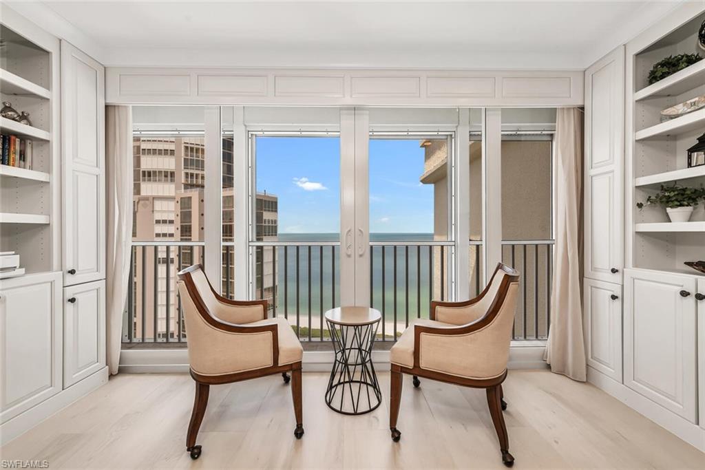 Sunroom with a water view