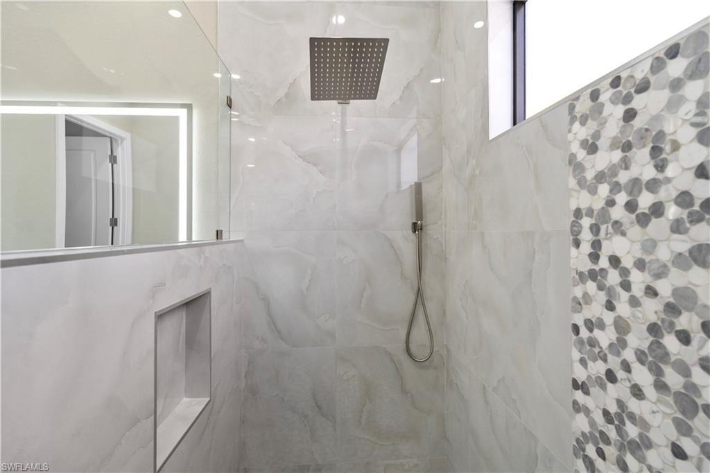 Master Full bathroom with a marble finish shower
