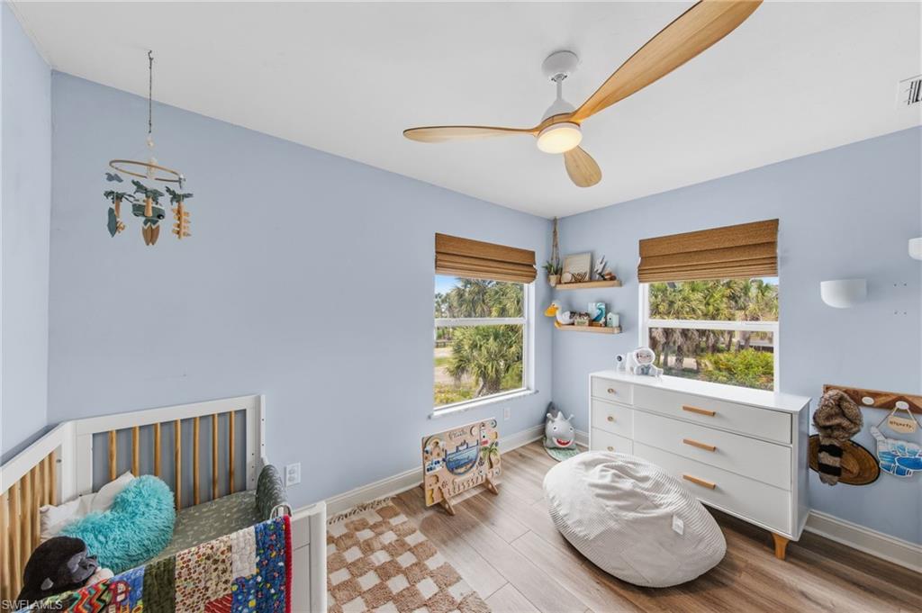 Bedroom featuring light wood-type flooring and a ceiling fan