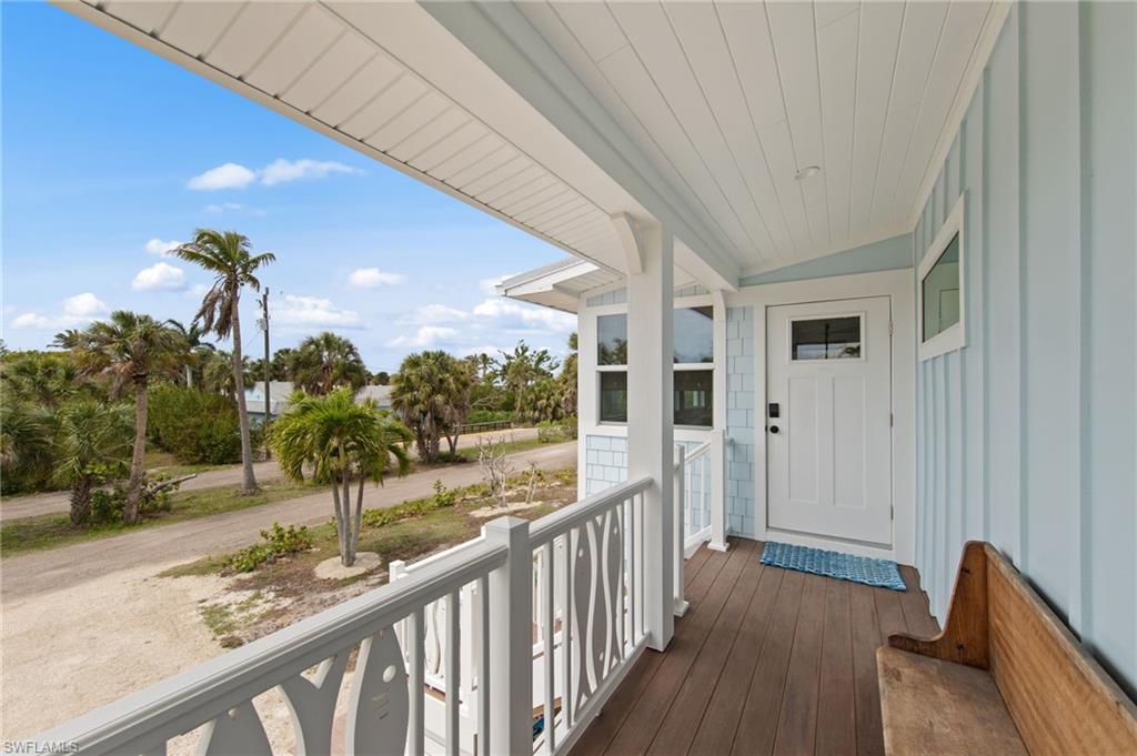 View of exterior entry with covered porch