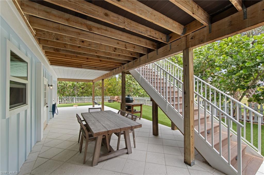 Fenced backyard featuring a patio and outdoor dining area