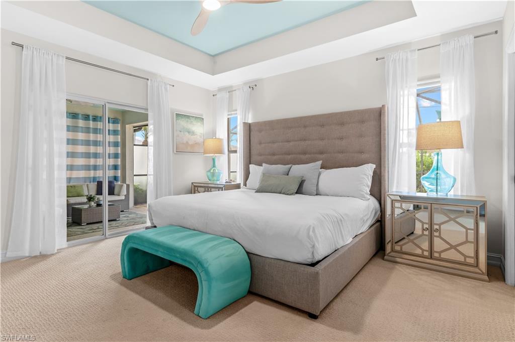 Tray ceiling with a light blue inset and a ceiling fan