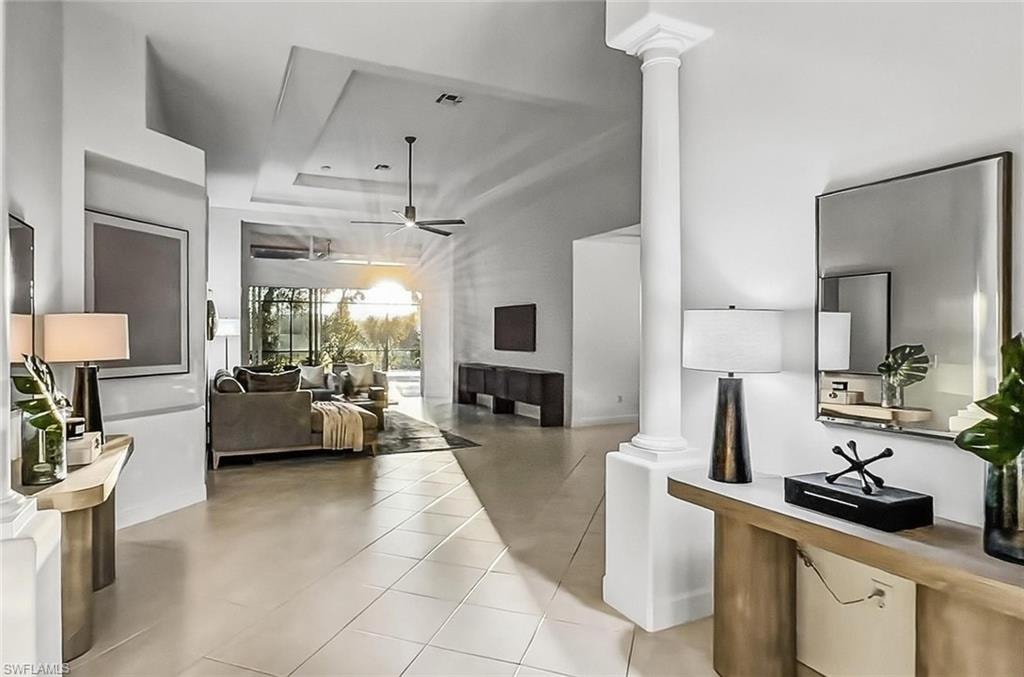 Spacious and bright expensive, open foyer with high volume entry ceiling and tray in Great Room near pool lanai.Stunning View to the pool entertainment from the front door entry for WOW factor / guest appeal!