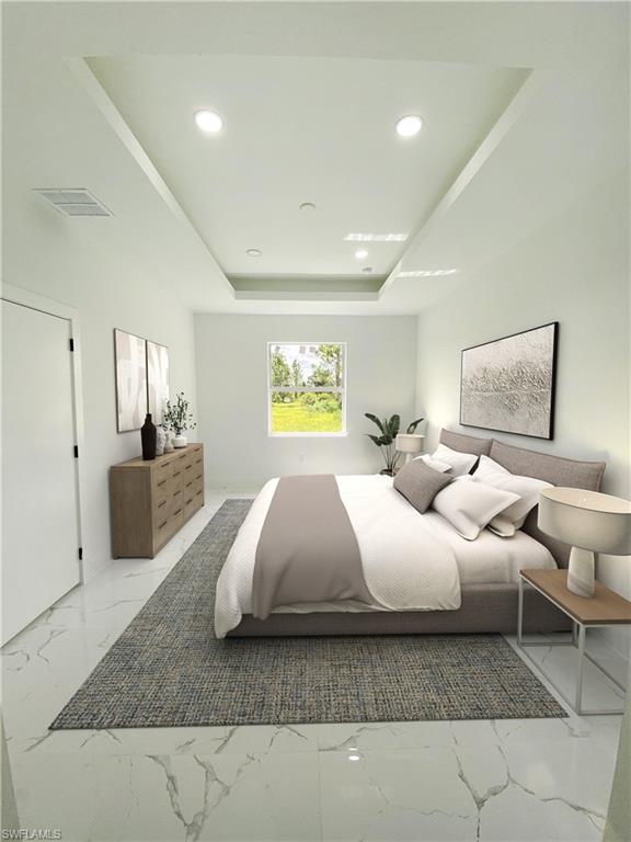 Bedroom featuring light marble finish flooring, recessed lighting, and a raised ceiling. Photos are of a staged model or similar plan. Features and finishes may vary.