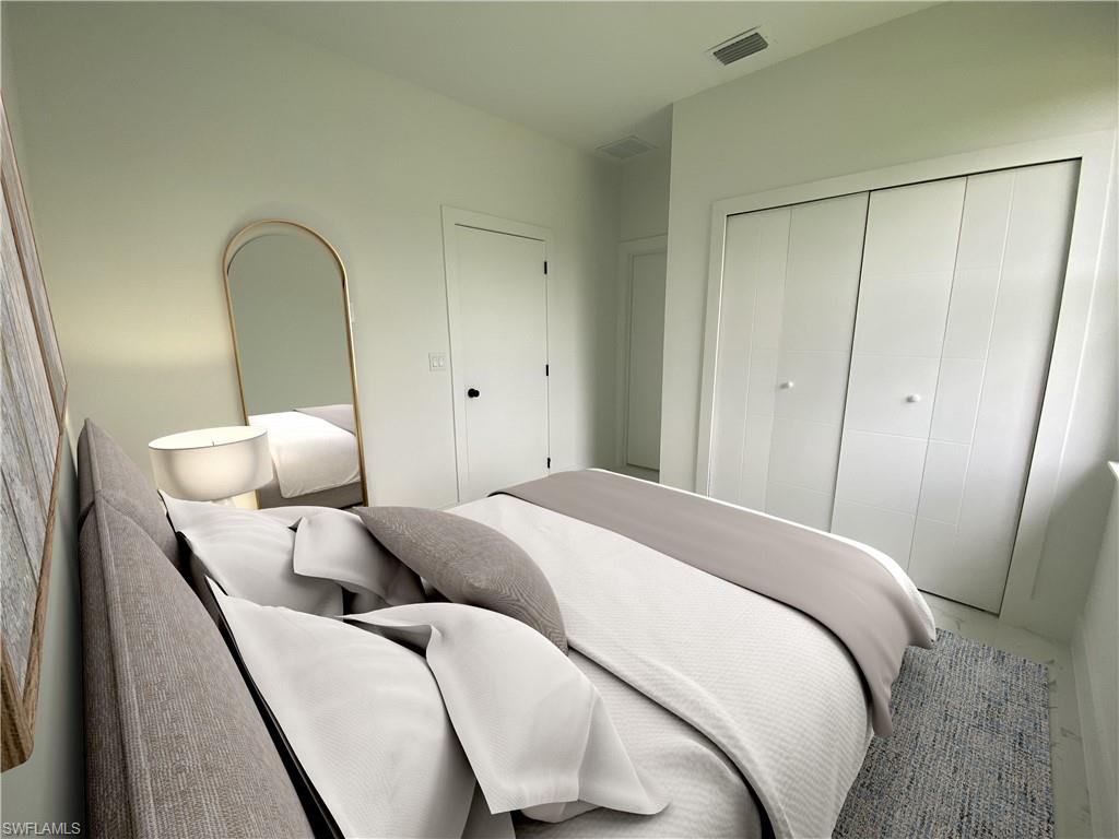 Bedroom with a closet.  Photos are of a staged model or similar plan. Features and finishes may vary.