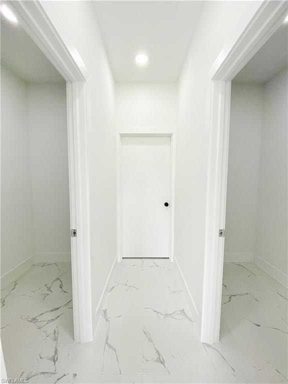 Hallway with baseboards and recessed lighting. Photos are of a staged model or similar plan. Features and finishes may vary.
