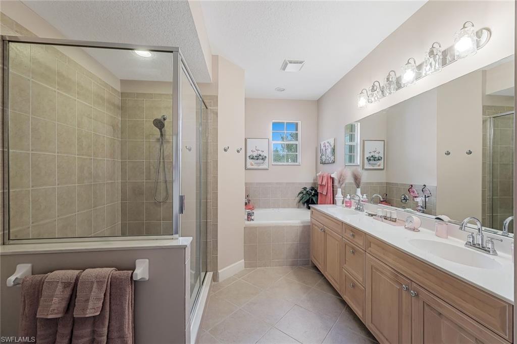 Dual sinks, garden tub and walk in shower...