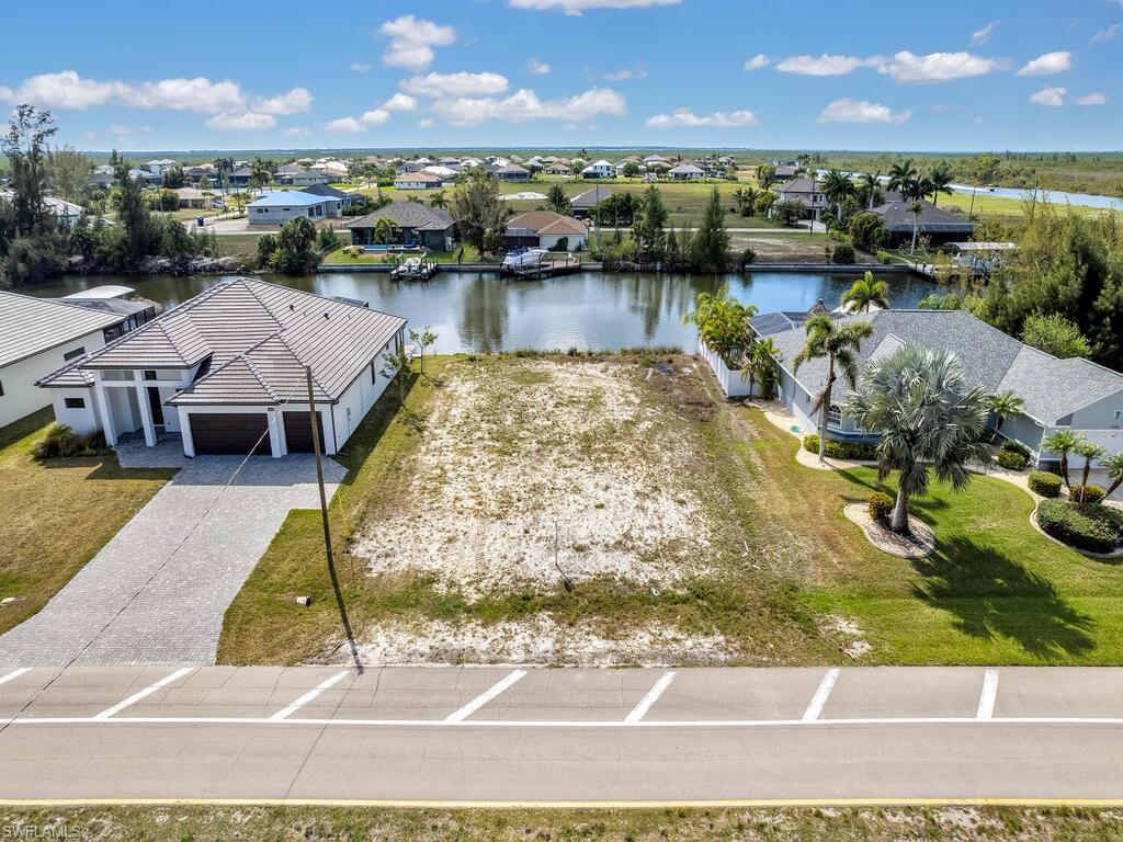 Aerial view of residential area with a large body of water