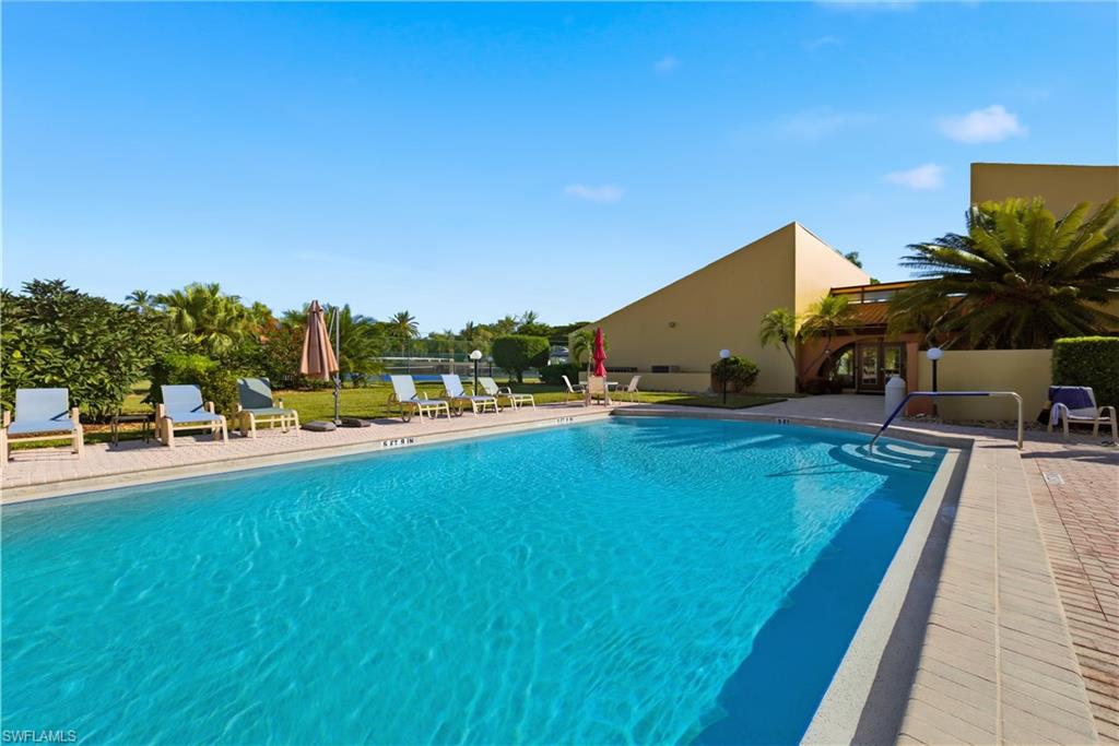 Outdoor swimming pool with brick paver surround