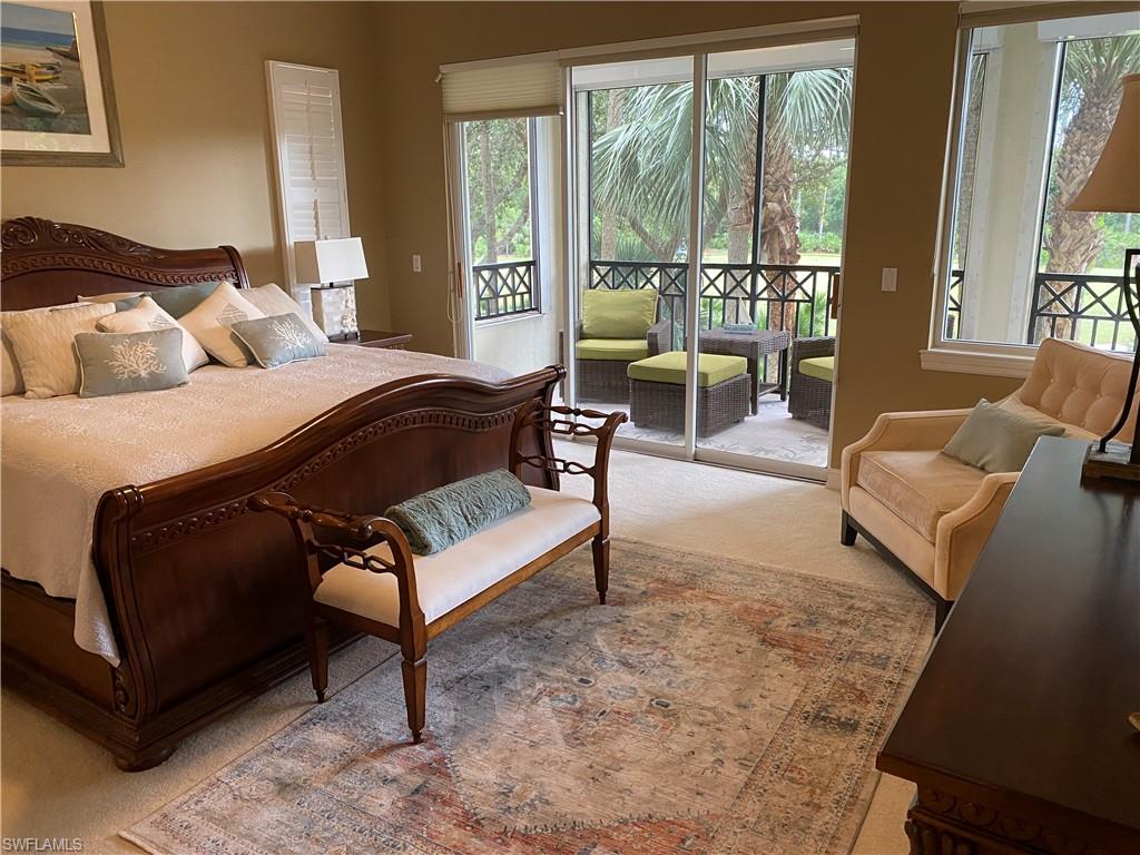 Carpeted bedroom with access to outside