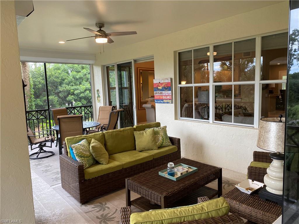 Sunroom / solarium with ceiling fan and outdoor furniture