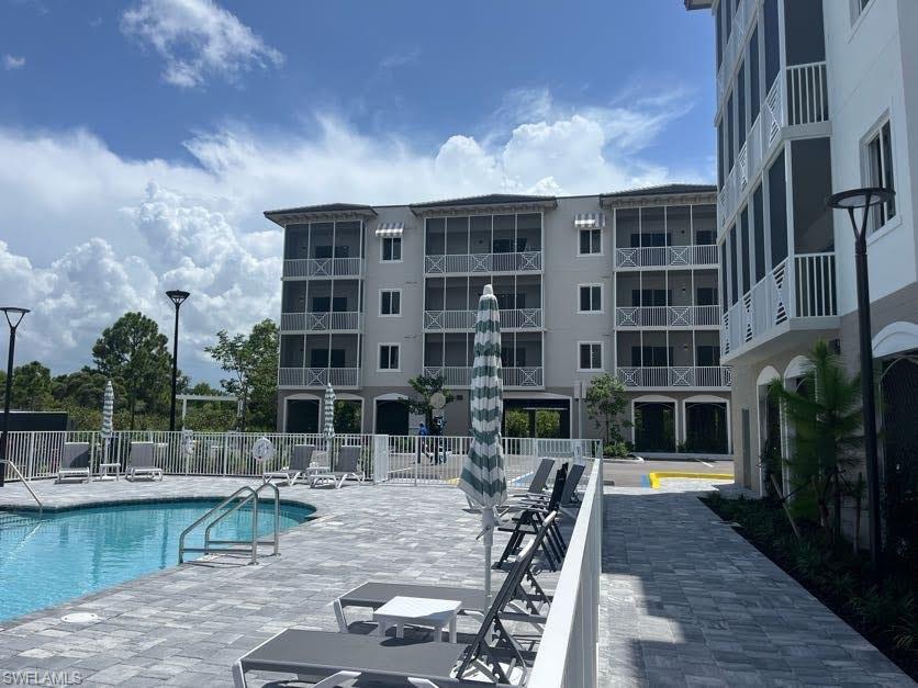 Community pool with a patio area