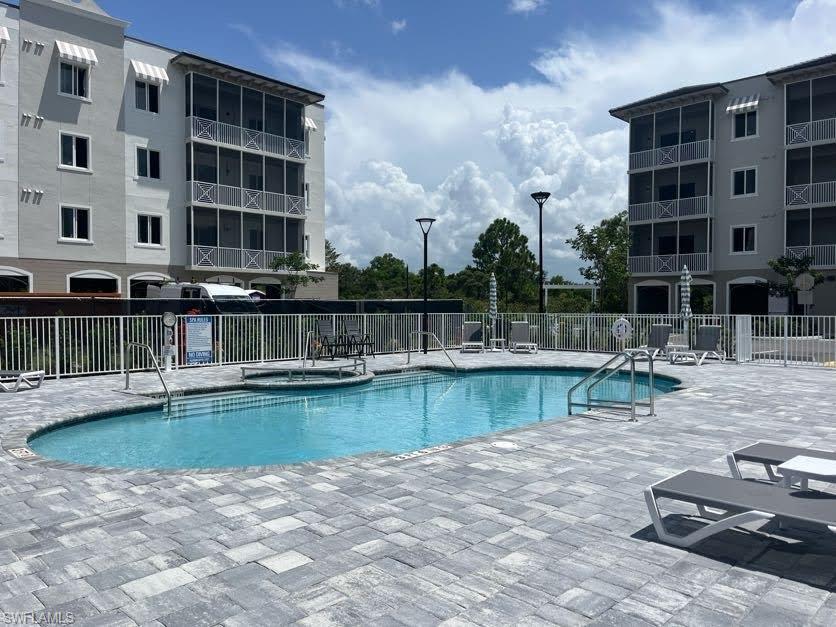 Community pool featuring a patio area