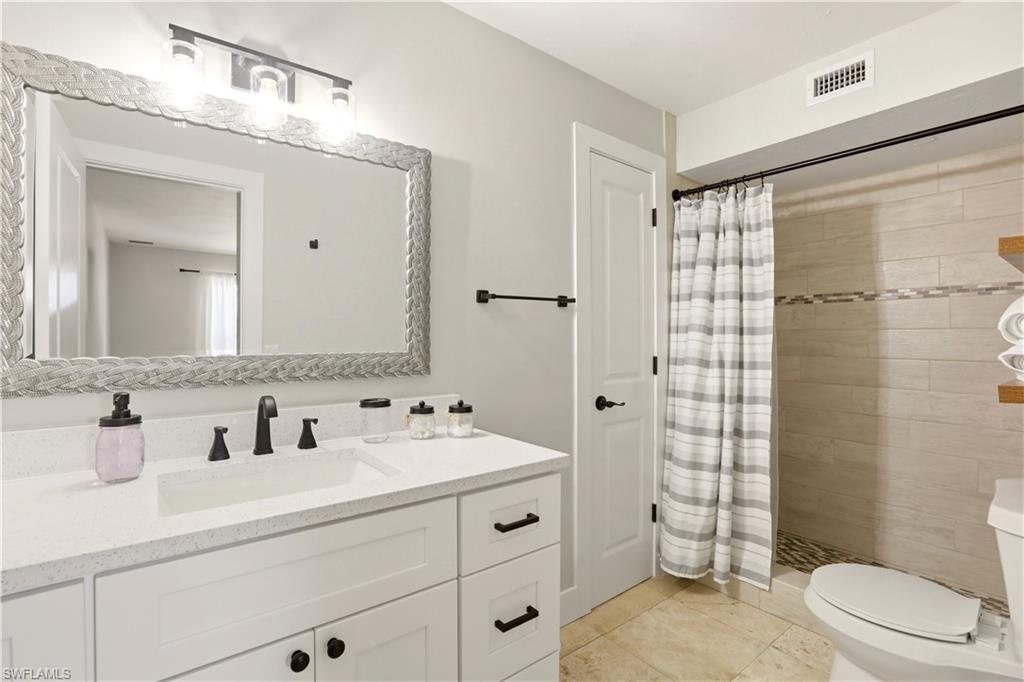 With walk in Shower and linen closet
