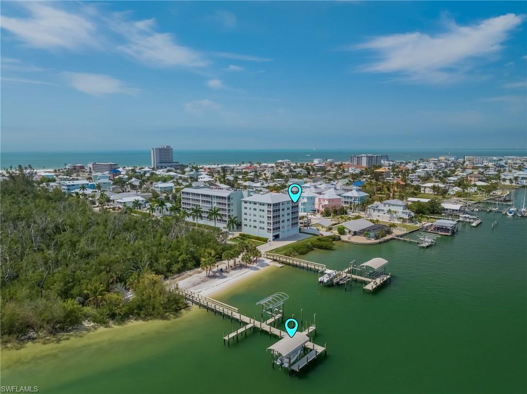 Bayfront 4th floor condo with a deeded dock, lift and boat cover.
