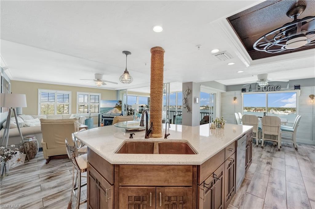 Open concept kitchen, living area, dining room and out onto the Lanai with water views everywhere!
