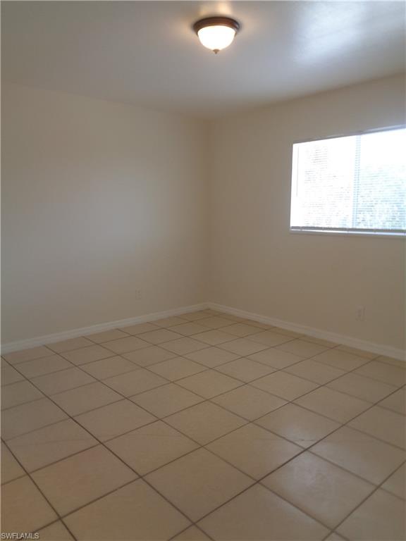 Master bedroom featuring light color tile floors