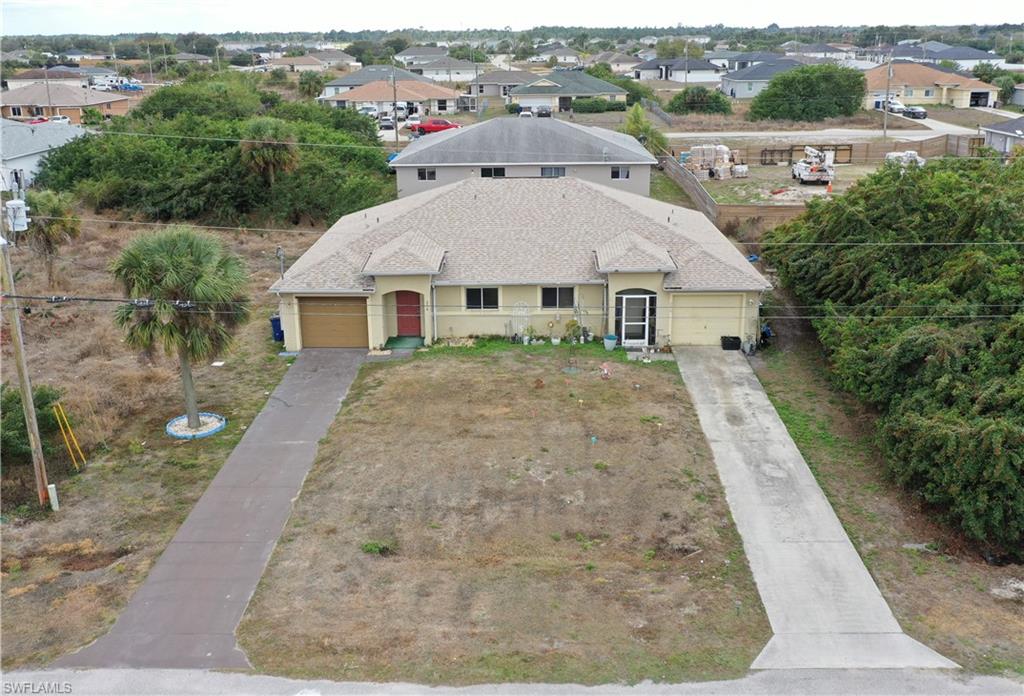 Front aerial wide view of the front of the duplex