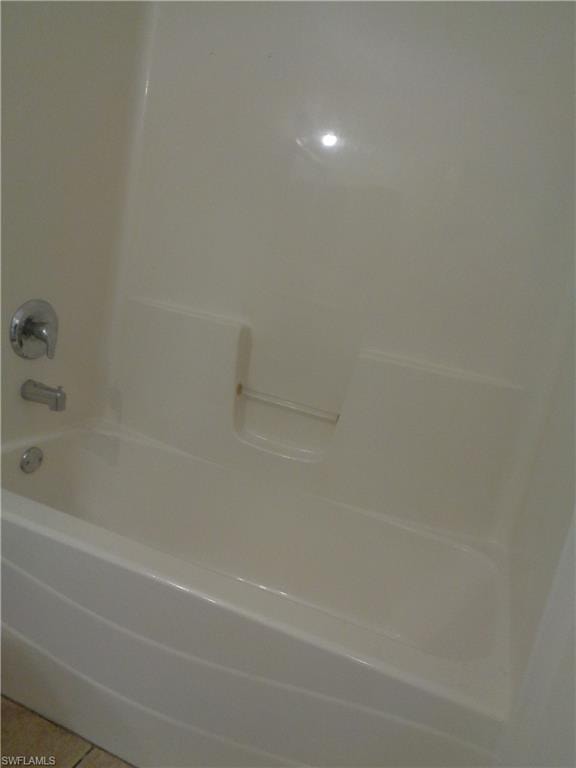 Guest bathroom featuring tub/shower