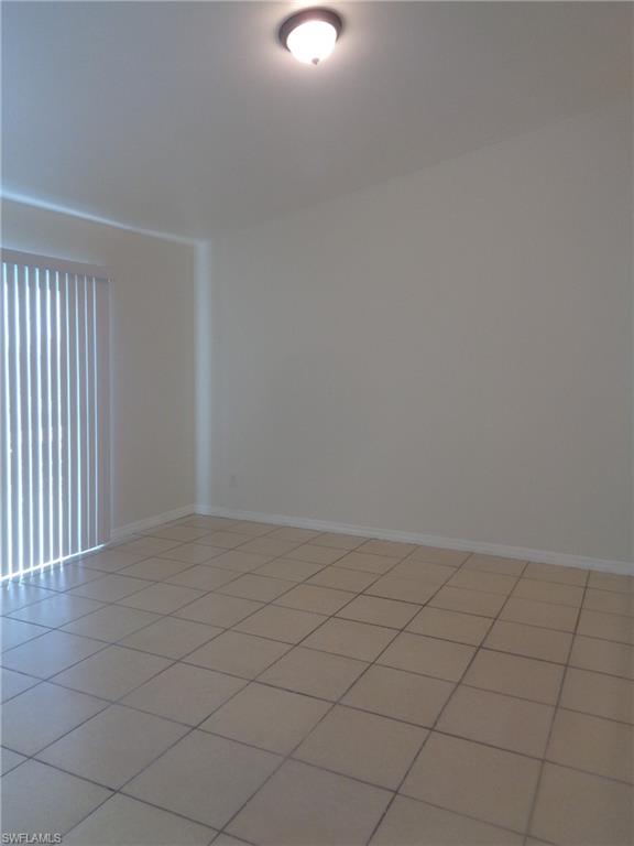 Living room featuring light patterned flooring