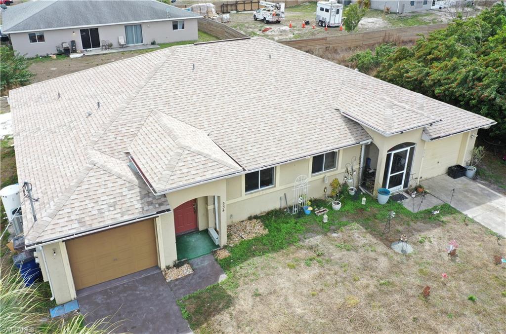 Left side aerial view of the duplex