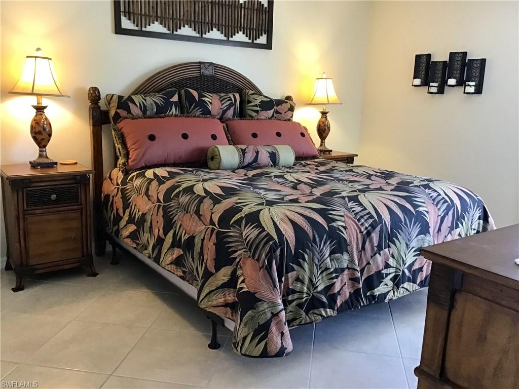 Primary bedroom has a king size bed