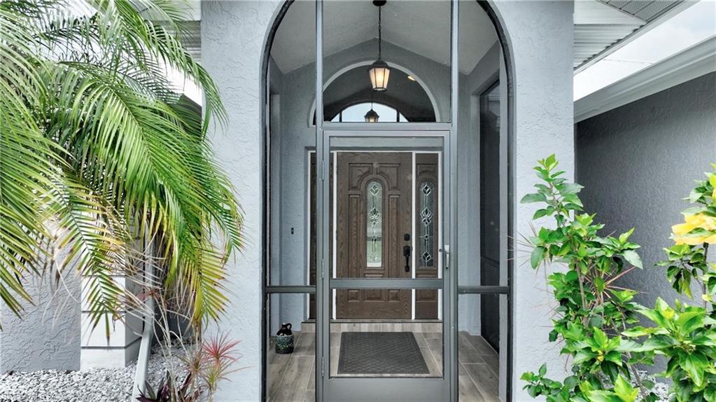 Property entrance with stucco siding