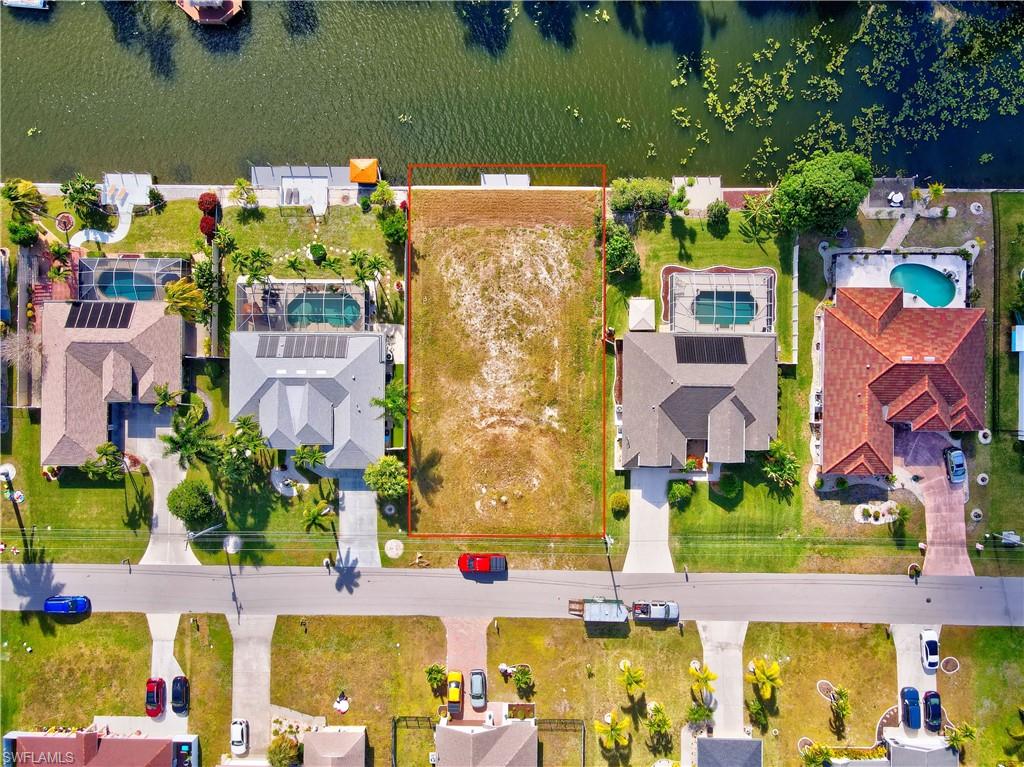 Aerial perspective of suburban area with property parcel outlined