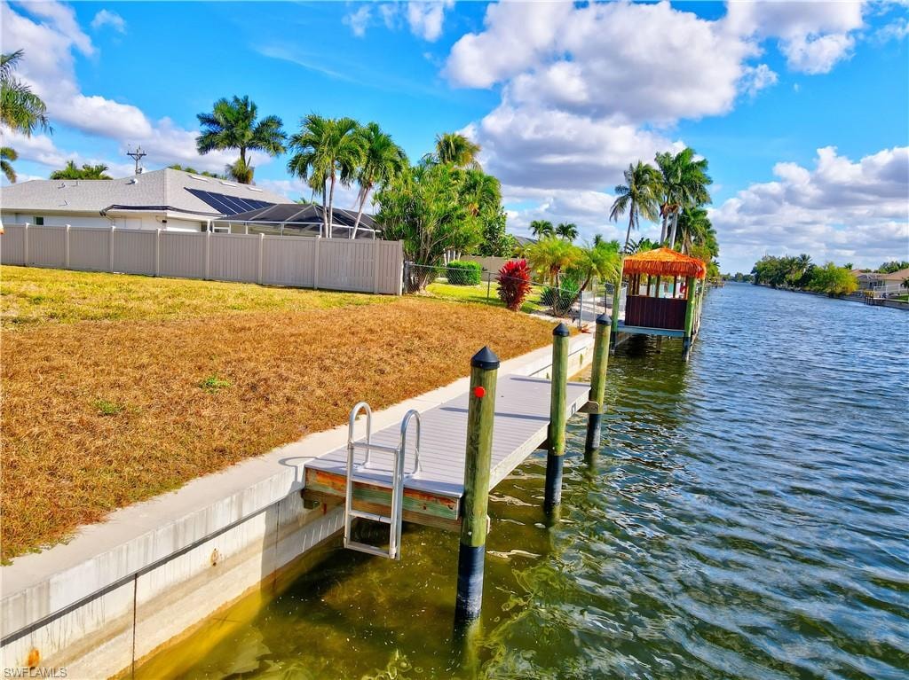 Dock area featuring a water view