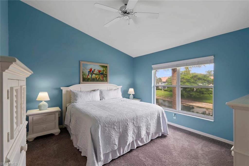 Main bedroom featuring large windows, walk-in closet, and attached en-suite bathroom