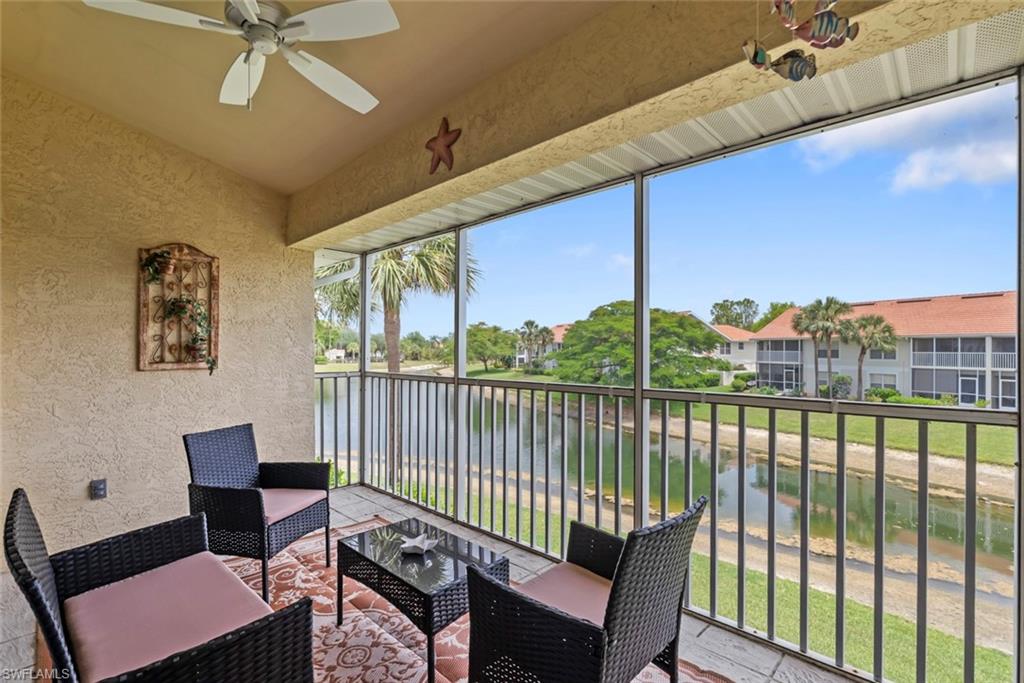 Serene lake view from the second-floor living area window in Carlton Lakes condo