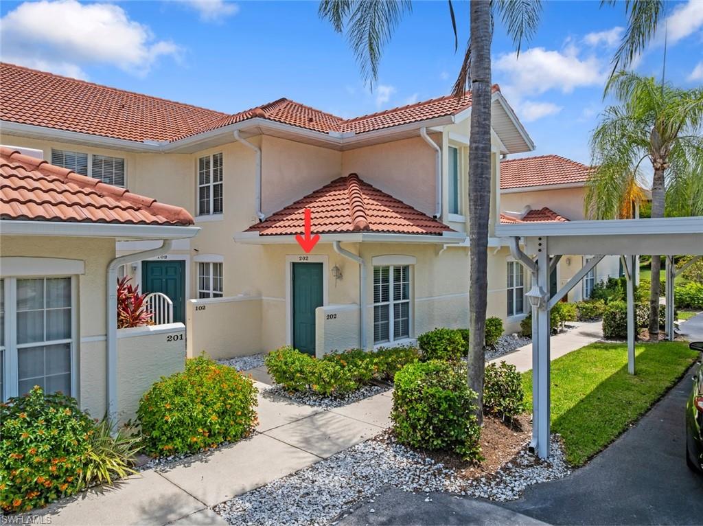 Front exterior of 4970 Deerfield Way #F202, a quiet cul-de-sac condo in Carlton Lakes, Naples, FL 34110