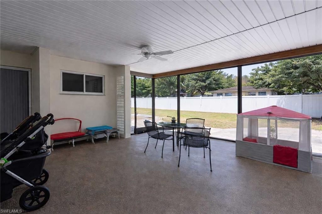 Spacious screened-in patio with backyard views