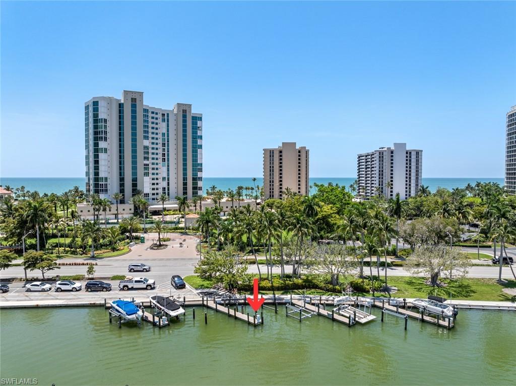 Boat slip in Doctors Bay of Park Shore along Gulfshore blvd N with the Gulf in the background