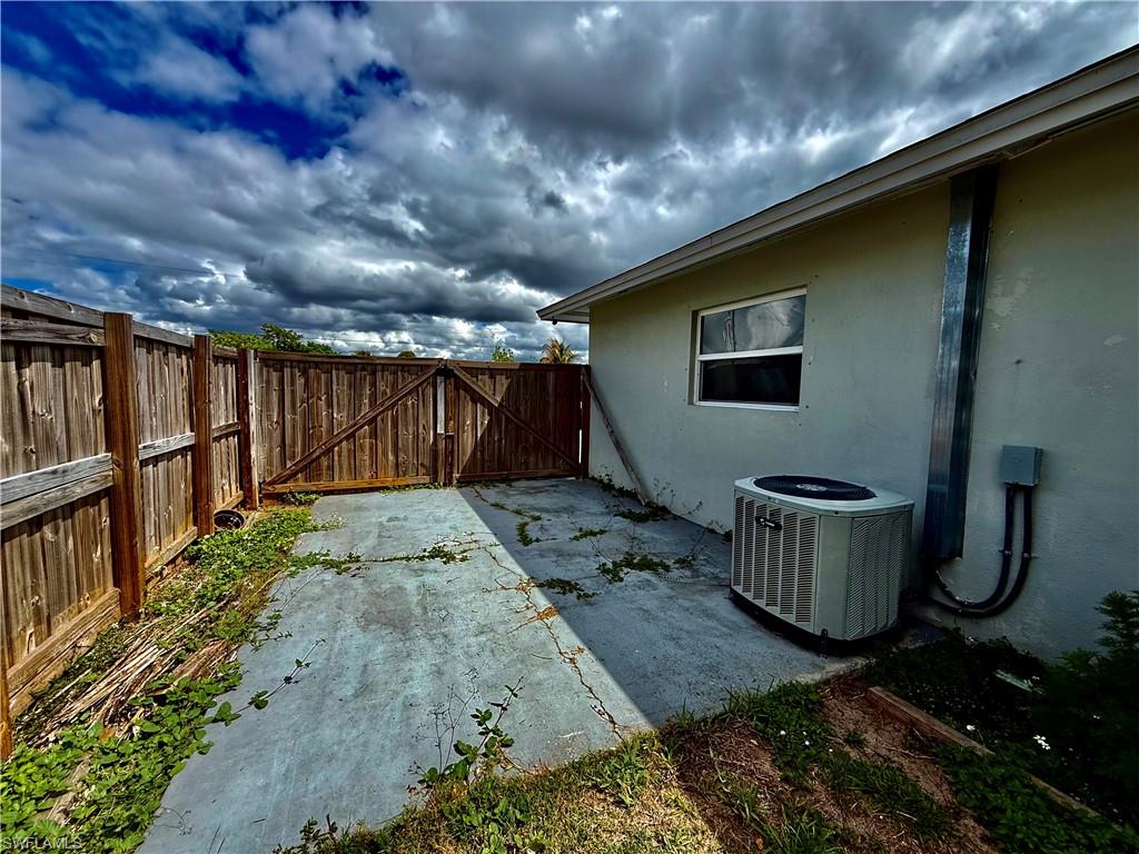 Double gate entry in to fenced backyard.