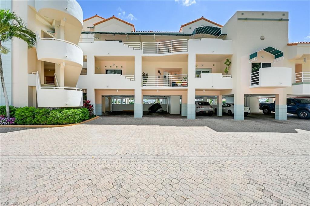 Exterior with assigned under building parking