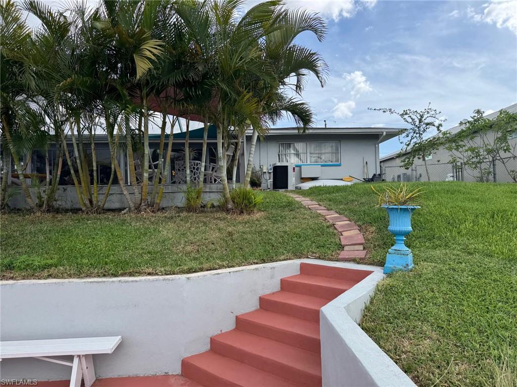 Easy access from the dock to the home. The back yard is fenced and there are double gates for easy access.