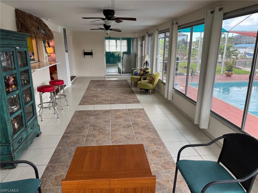 Love this room.  The primary suite and one guest bedroom both open to this room over looking the pool.